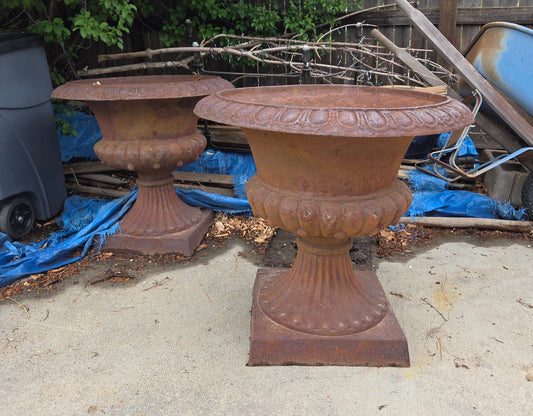 Pair of iron urns
